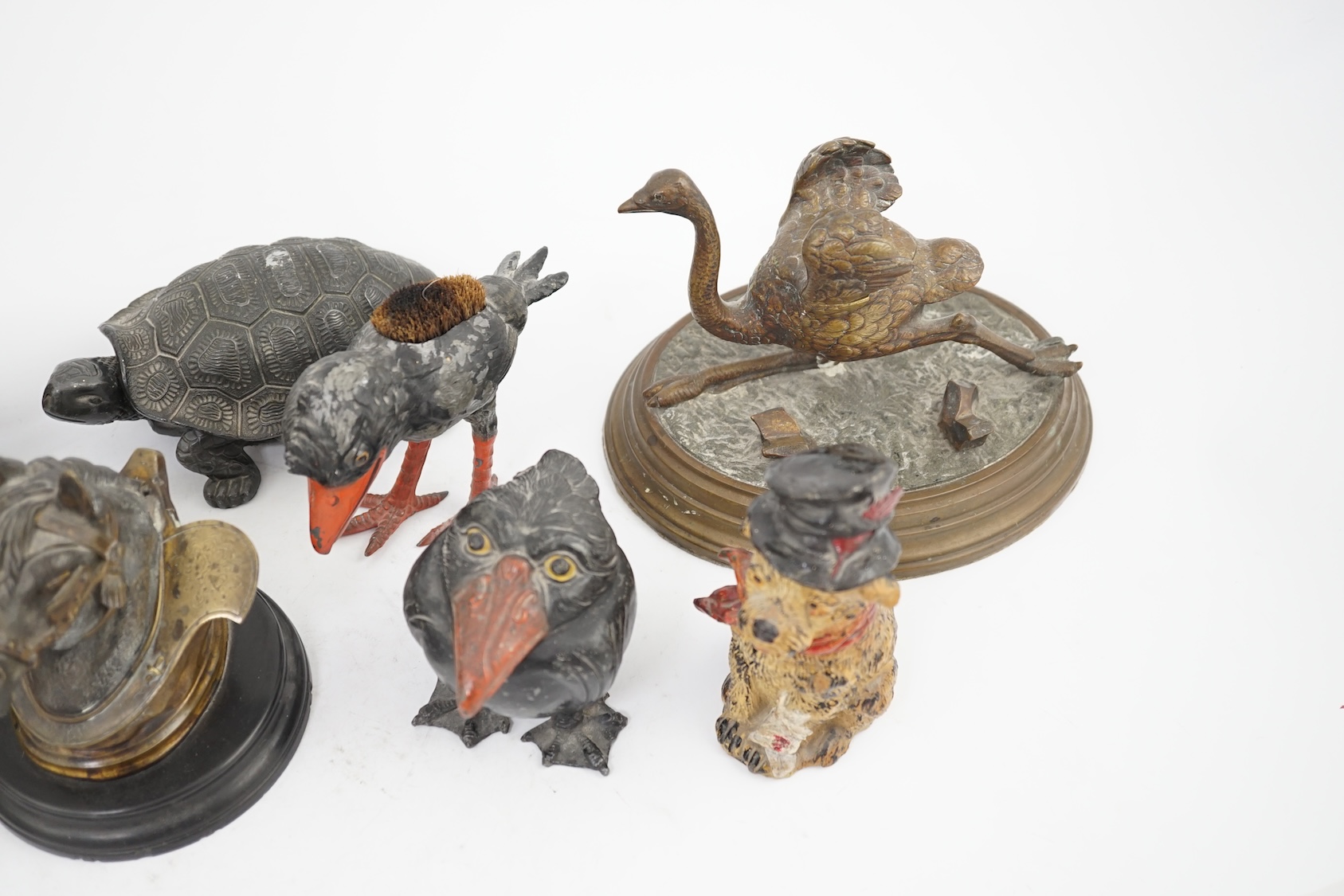 A collection of nine 19th and 20th century novelty animal bronze and metal ink wells, including a Martin Brothers-style ‘Wally’ inkwell. Condition - minor chips due to use and age